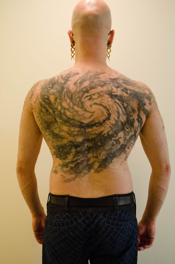 Cosmic tattoo of M74 galaxy covering full back for astronomy enthusiast.