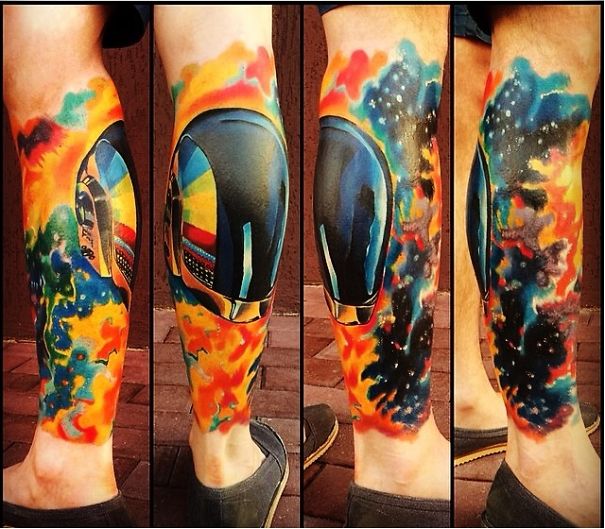 Colorful Daft Punk space-themed leg tattoo for astronomy lovers.