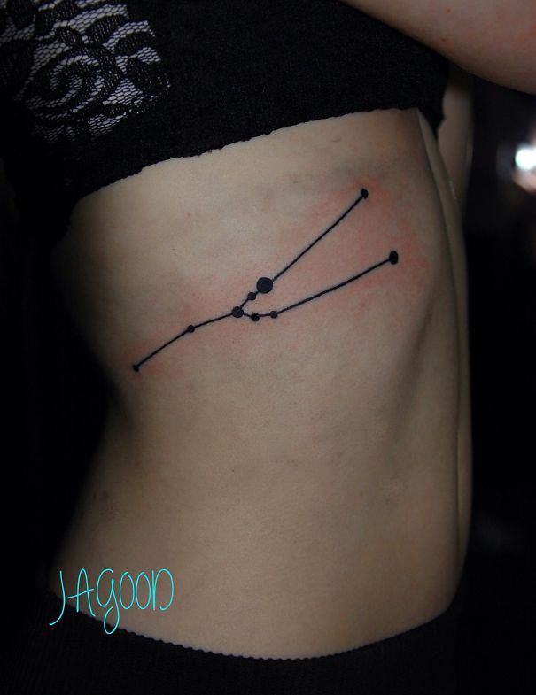 Taurus constellation tattoo on cheekbone, ideal for astronomy enthusiasts.