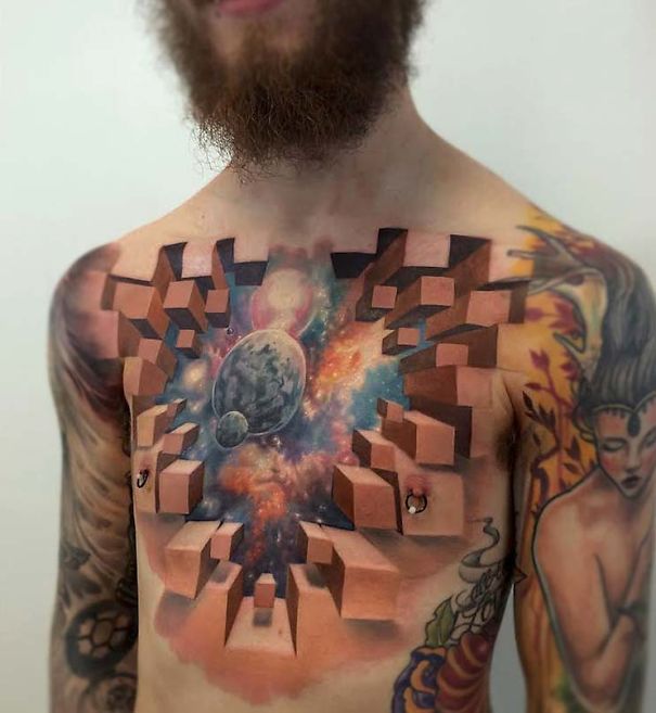 Colorful cosmic tattoo of planets on a person's chest.