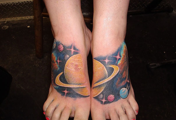 Colorful cosmic tattoo featuring planets and stars on feet for astronomy lovers.