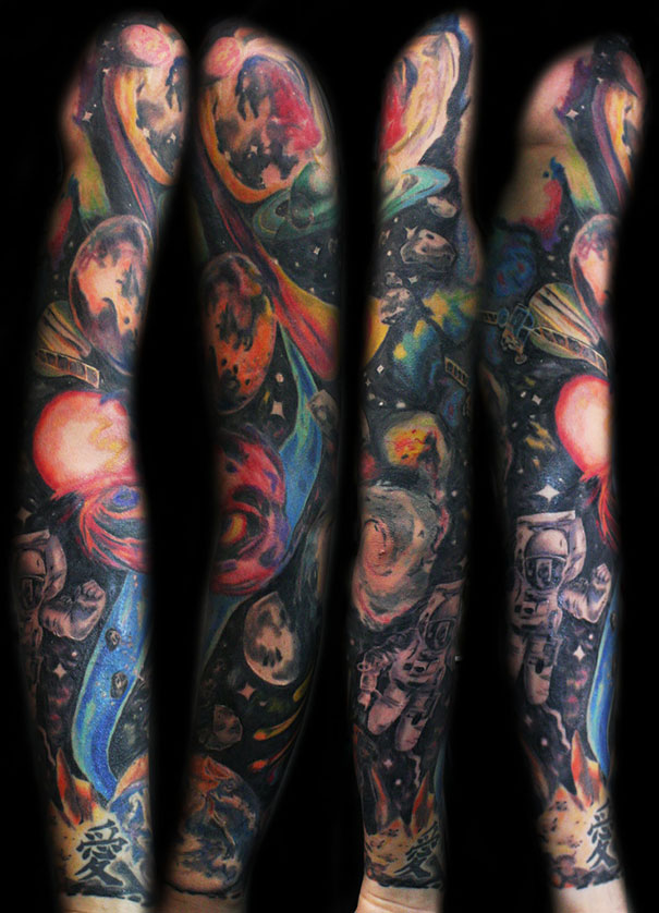 Colorful full arm tattoo of cosmic imagery for astronomy lovers.