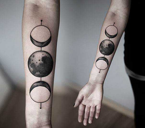 Planetary phases tattoo on arm, perfect for astronomy lovers.