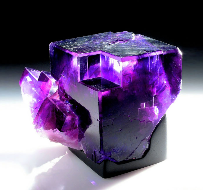Beautiful purple mineral with crystal-clear facets on display.