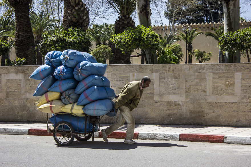 Moroccan Worker Passing By The Imperial Palace Gardens