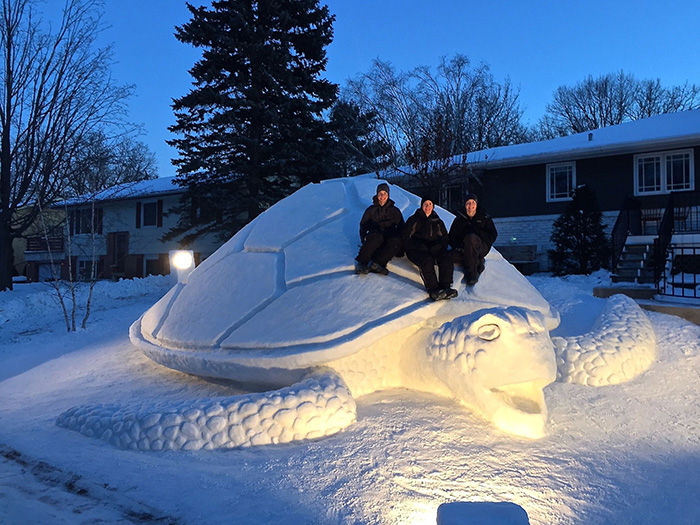 Every Year, These 3 Brothers Make A Giant Snow Sculpture In Their Front Yard