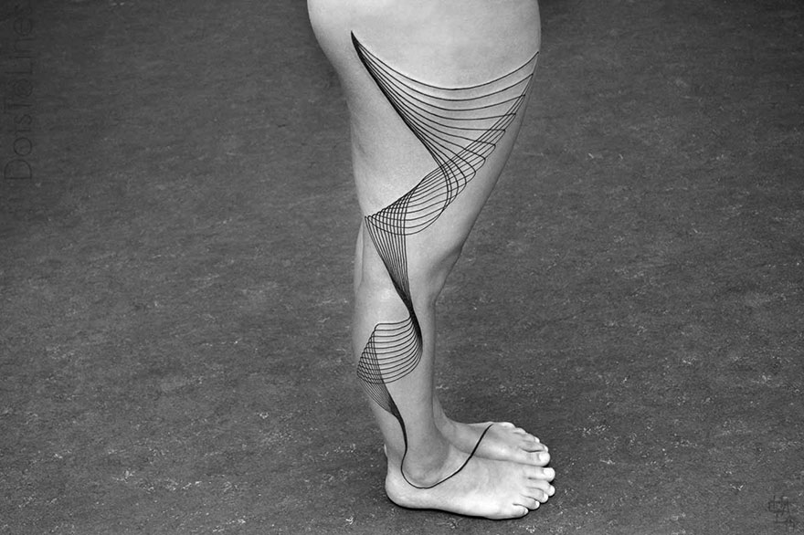 Geometric line tattoo by Chaim Machlev elegantly flows across a person's leg, showcasing intricate design and artistry.