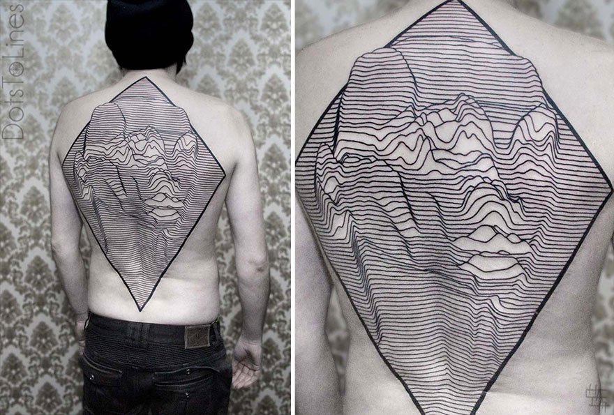 Geometric line tattoo by Chaim Machlev, elegantly flowing across a person's back with intricate patterns.