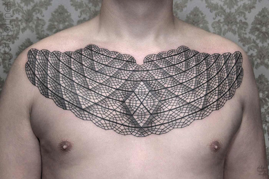 Geometric line tattoo on chest by Chaim Machlev, featuring intricate black patterns flowing elegantly across the body.