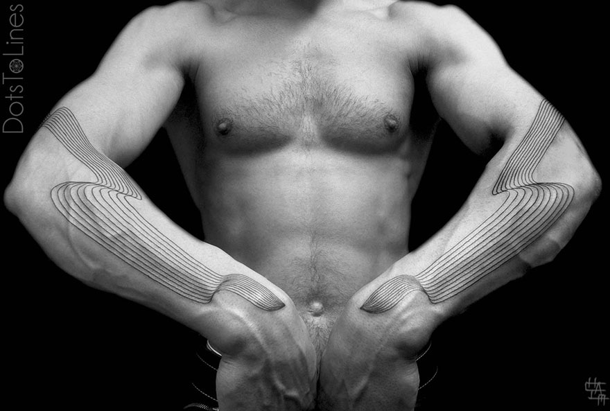 Geometric line tattoos by Chaim Machlev gracefully flow across a person's arms, creating elegant patterns on the skin.