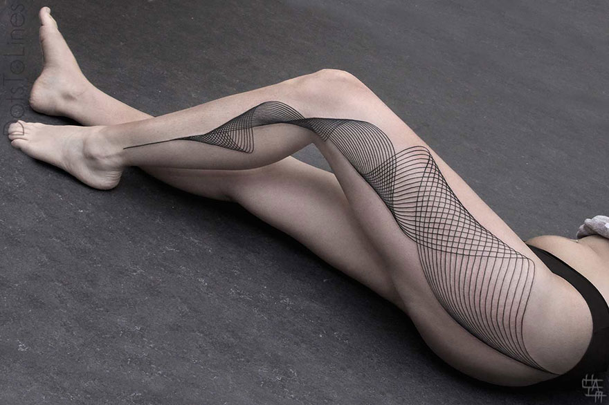 Geometric line tattoo by Chaim Machlev elegantly flows across a woman's leg, showcasing intricate patterns.