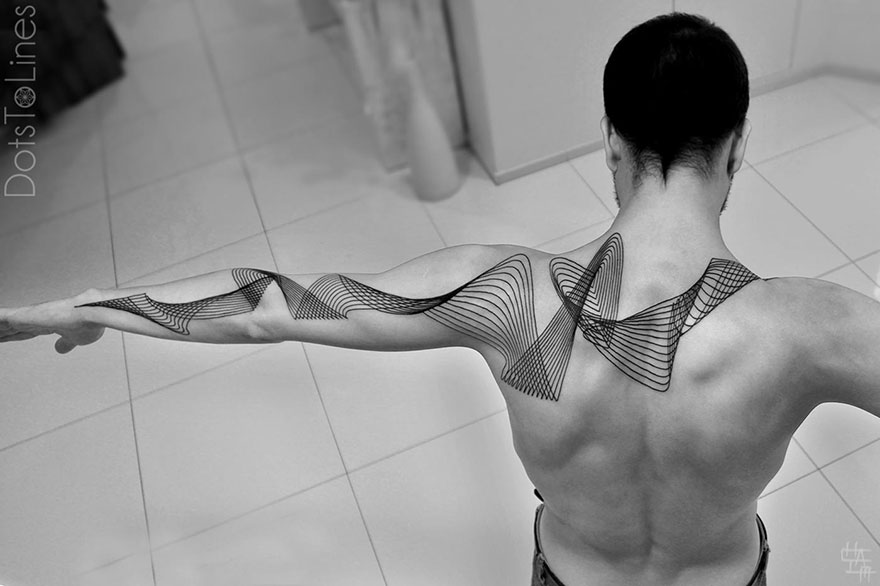 Geometric line tattoo by Chaim Machlev elegantly flows across a person's back and arm.