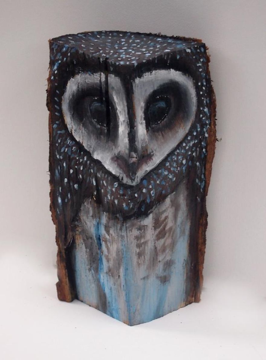 Owls On Wooden Logs