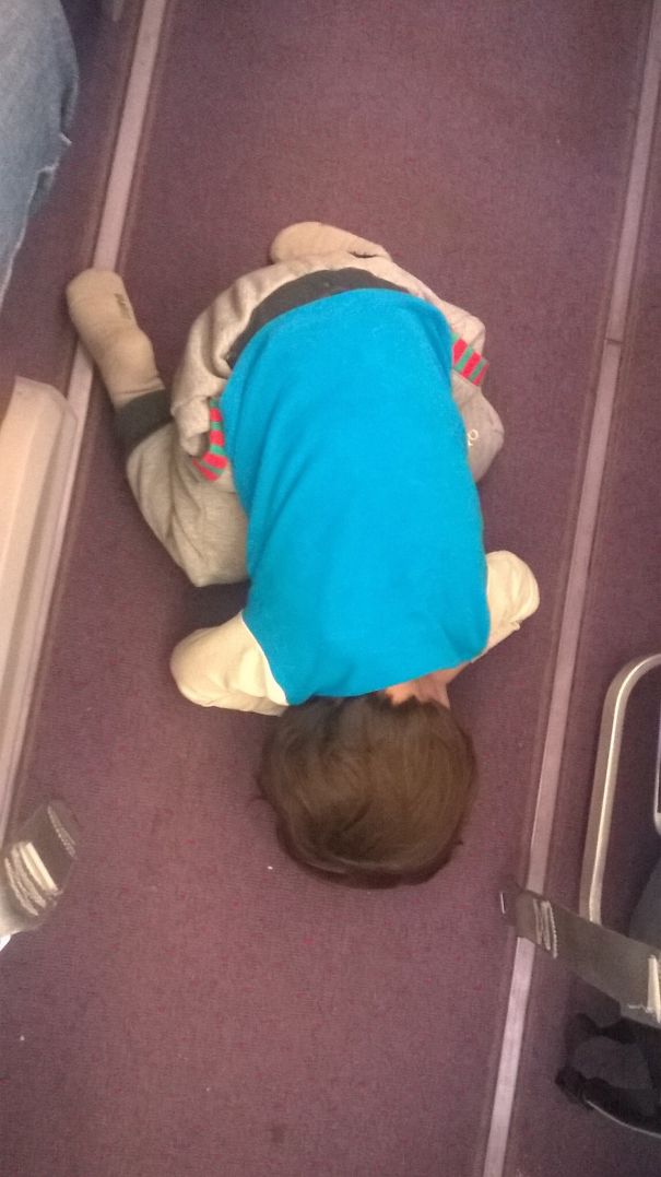 Taking A Nap On A Plane Aisle