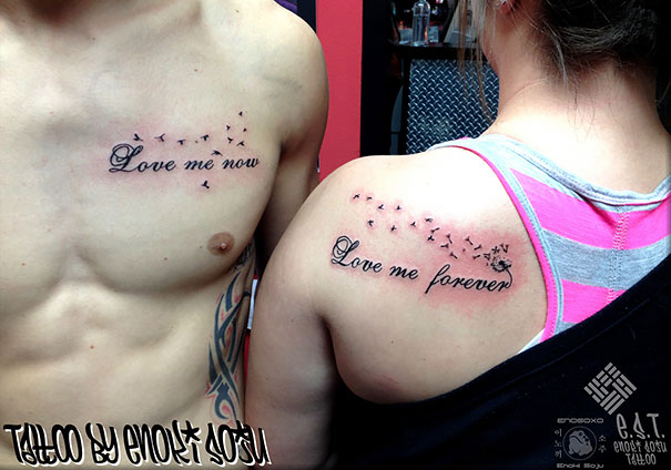 Matching couple tattoos reading "Love me now" and "Love me forever" on a man's chest and a woman's shoulder.
