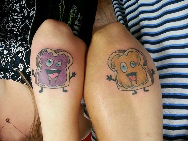 Couple tattoos of toast with jam and peanut butter characters on arms.