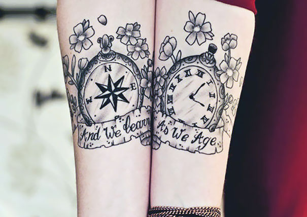 Matching couple tattoos with a compass and clock, symbolizing growth and aging together.