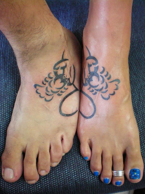 Matching couple tattoos on feet, featuring mirrored scorpion designs.