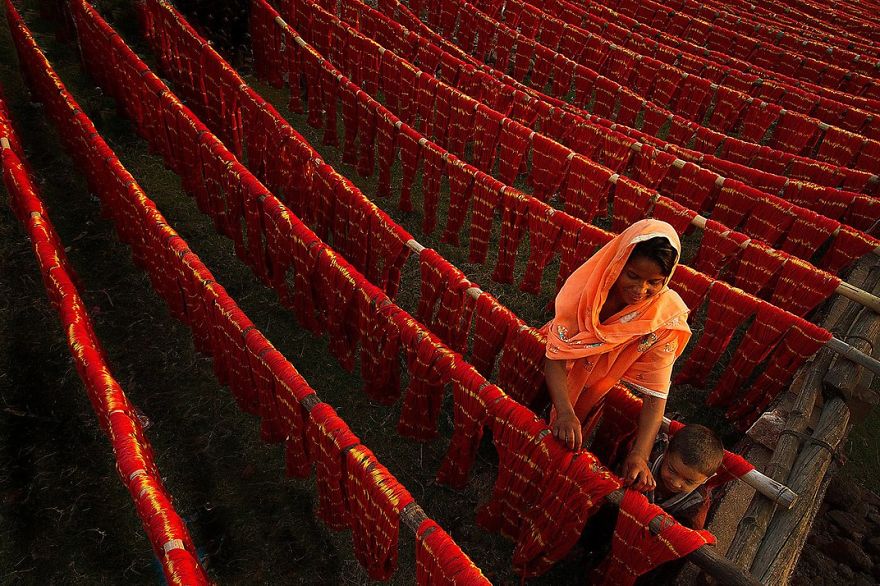 A Woman And Her Child Place Dyed Threads Out To Dry, Santipure, Nadia, India