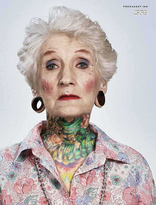 Elderly woman with colorful neck tattoo, showcasing how senior tattoos look over time, in a floral shirt and earrings.