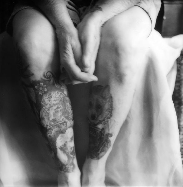 Tattooed senior with intricate leg tattoos, showcasing how ink appears on aging skin.