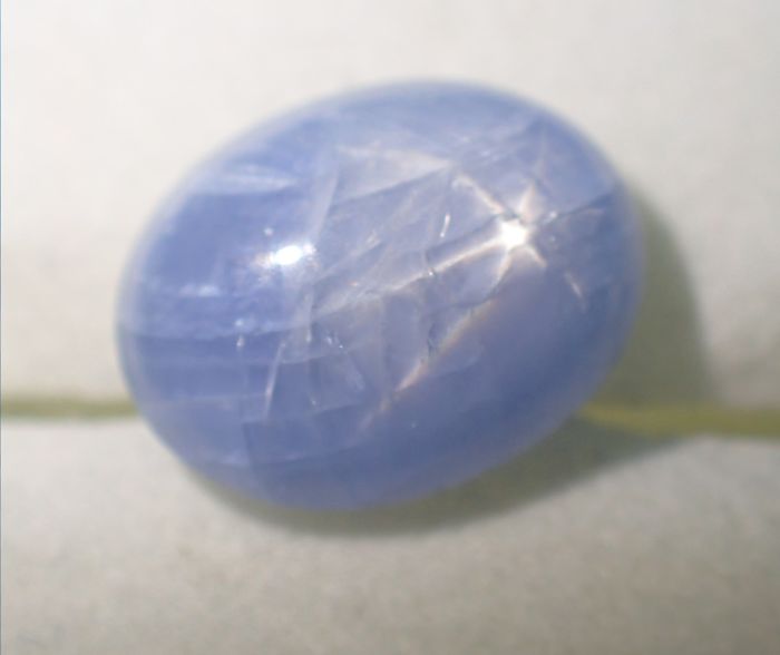 A stunning blue star sapphire, showcasing the unique beauty of minerals and stones.