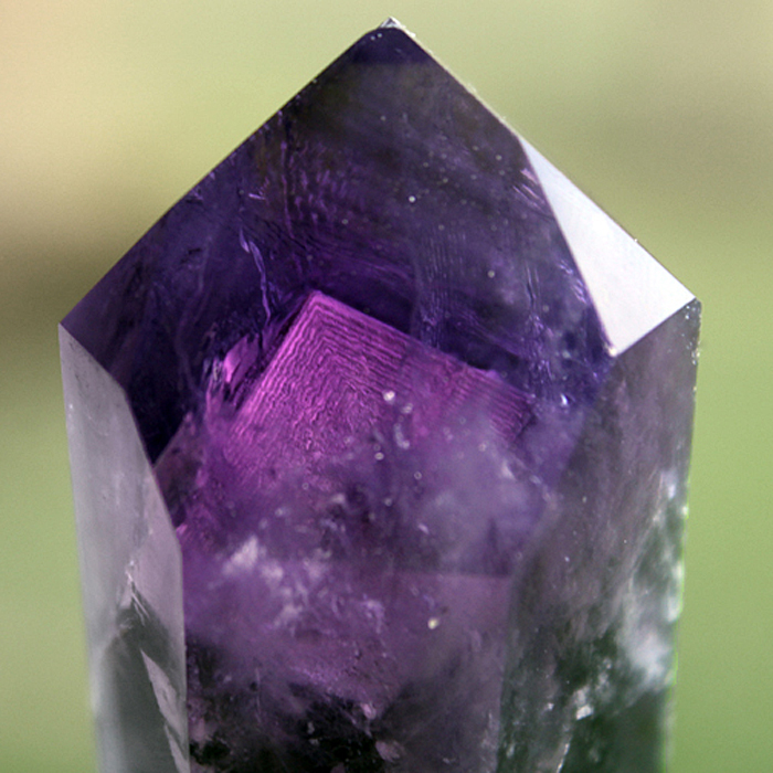 Purple mineral with crystalline structure, showcasing its beauty and intricate details.