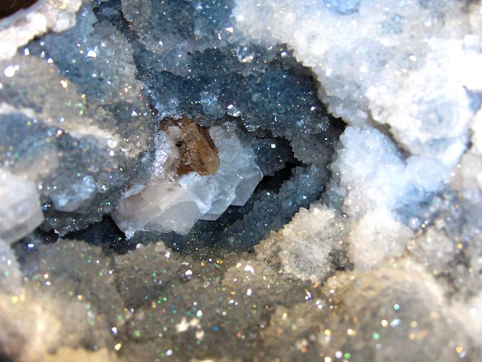 Stunning close-up of beautiful sparkling minerals inside a geode.