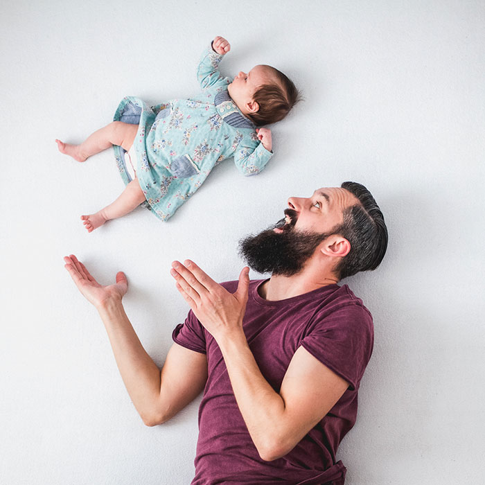 Fun Pictures Of Dad Playing With Newborn Daughter (No Photoshop)