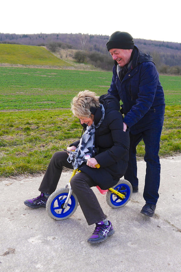 Having Fun With Their Grandson's Balance Bike