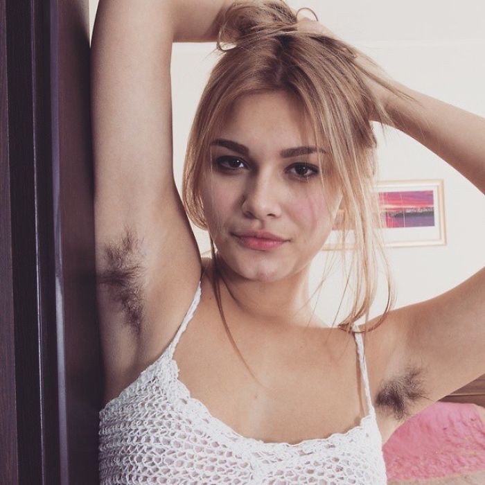 Woman Showing Her Armpit Hair.