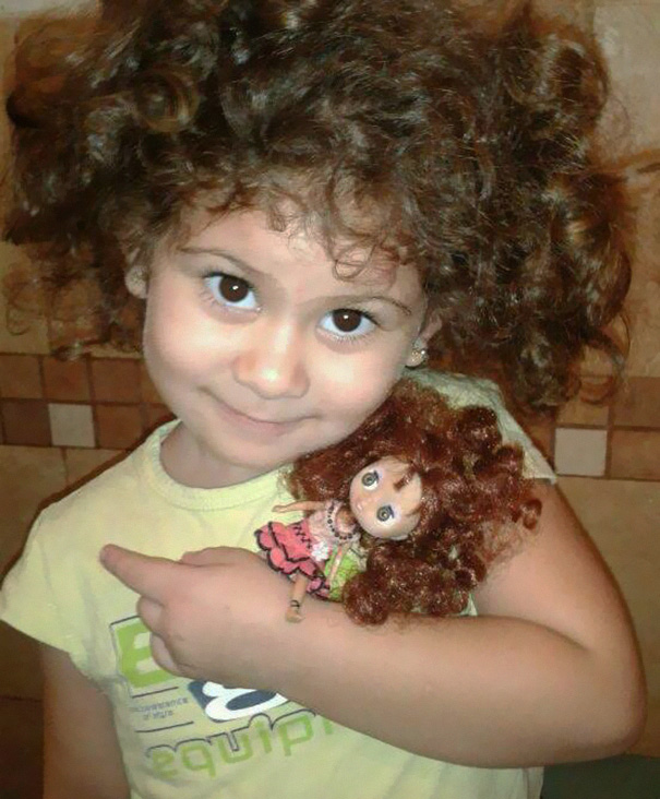 Girl With Her Look Alike Doll