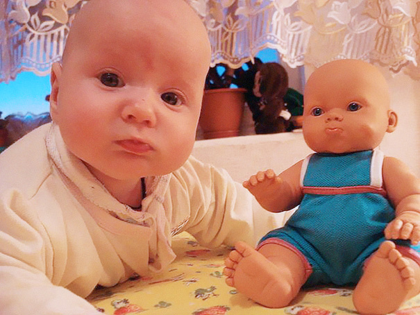 Baby With A Look Alike Doll