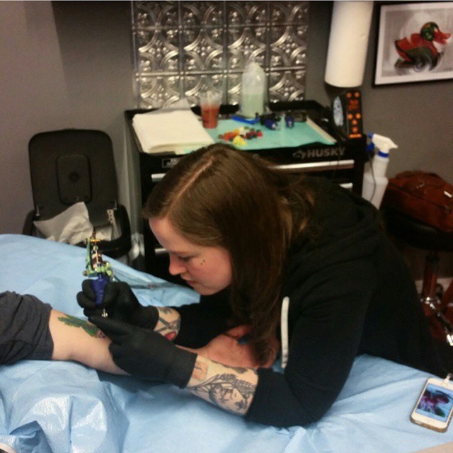 Tattoo artist working on a Pikachu cover-up design at a studio. Tattoo artist working on a Pikachu cover-up design at a studio.