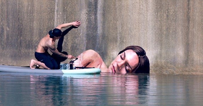 Artist Paints Stunning Seaside Murals While Balancing On A Surfboard