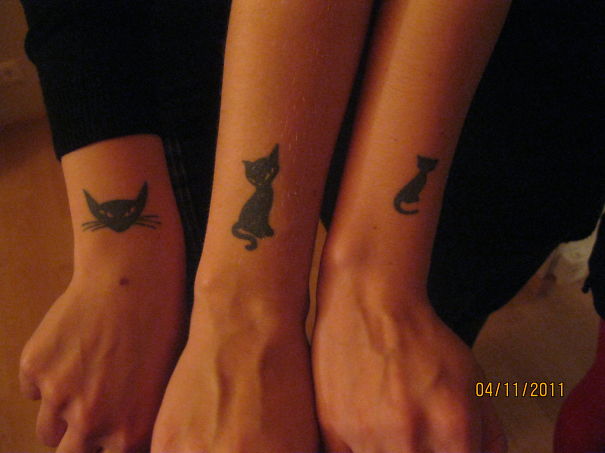 Simple cat tattoos on forearms, featuring minimalistic line art for cat lovers.