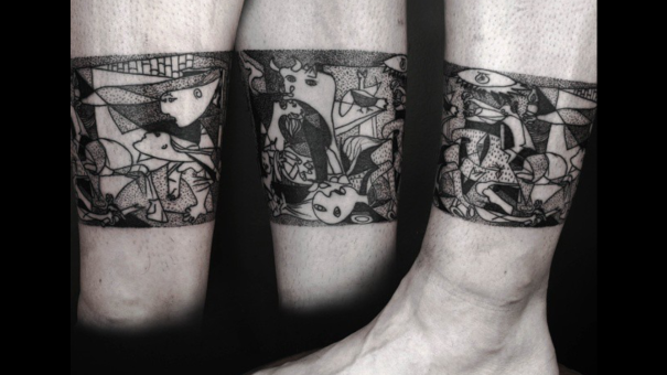 Abstract Picasso-inspired tattoo with cubist elements on forearm.