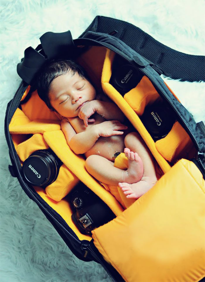 Baby In Camera Bag