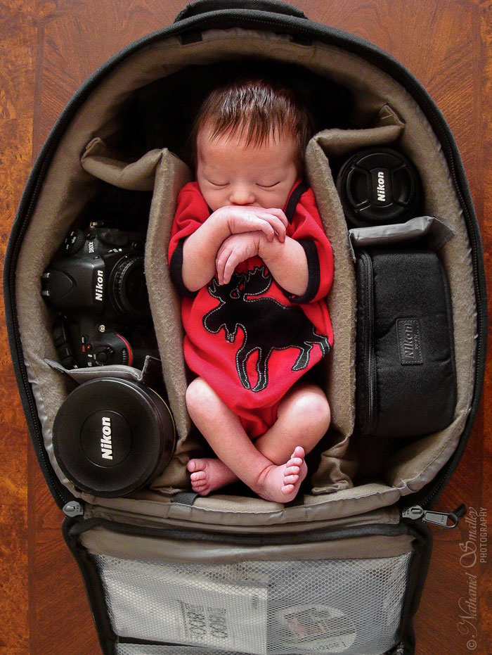 Baby In Camera Bag