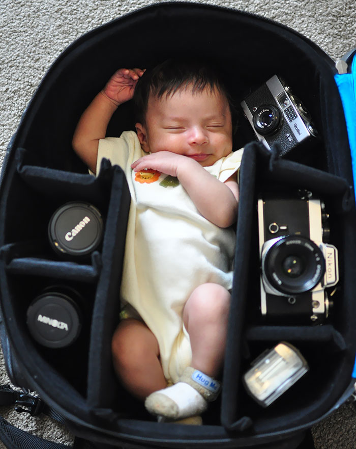 Baby In Camera Bag