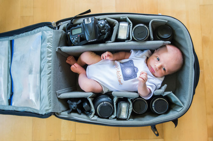 Baby In Camera Bag