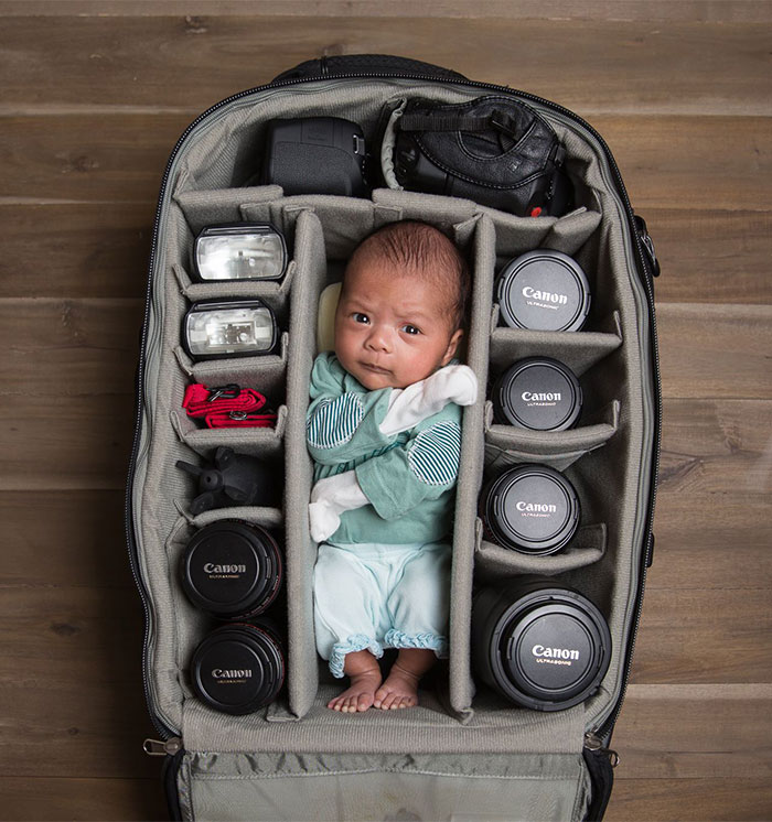 Baby In Camera Bag