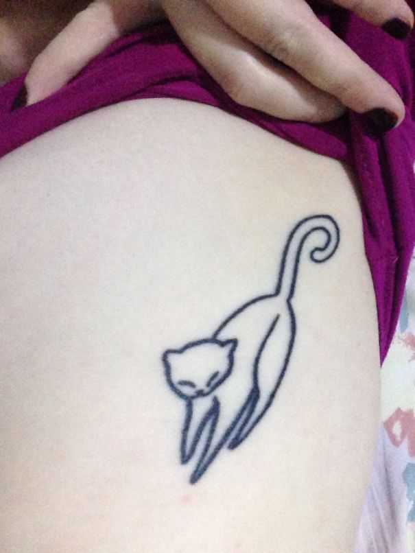 Simple line art cat tattoo design on skin, ideal for cat lovers.