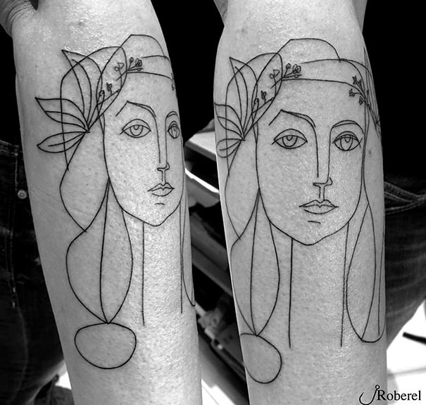 Picasso-inspired tattoo featuring abstract line drawing on a forearm, showcasing artistic and minimalistic design.