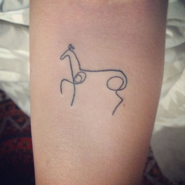 Minimalist line tattoo on arm, inspired by Picasso art style.