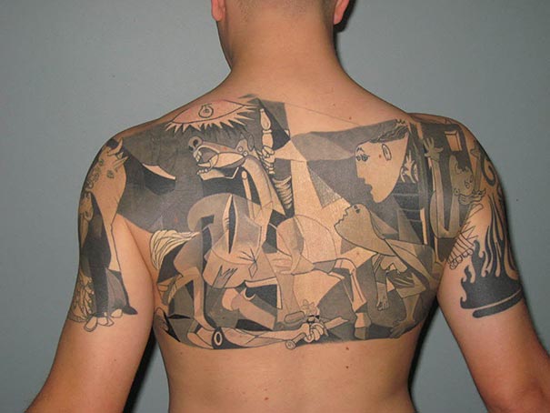 Back tattoo featuring Picasso-inspired abstract artwork in grayscale, covering the shoulders and upper back.