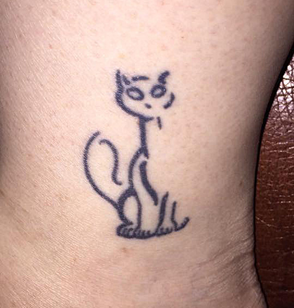Simple cat tattoo design in line art on ankle for cat lovers.