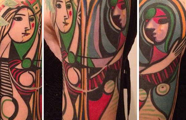 Colorful Picasso-inspired tattoo sleeve showcasing abstract faces and geometric shapes.