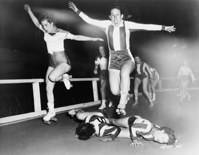 Two Women’s League Roller Derby Skaters Leap Over Two Who Have Fallen (1950)