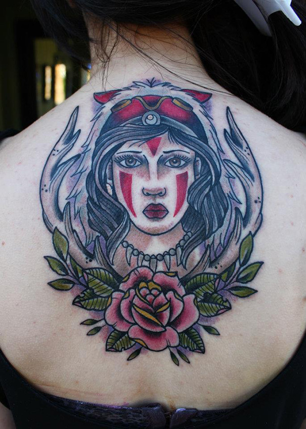 Studio Ghibli tattoo featuring a character Princess Mononoke with tribal markings and floral elements on the back.